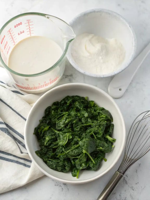 Step 2 for spinach casserole recipe — process in progress
