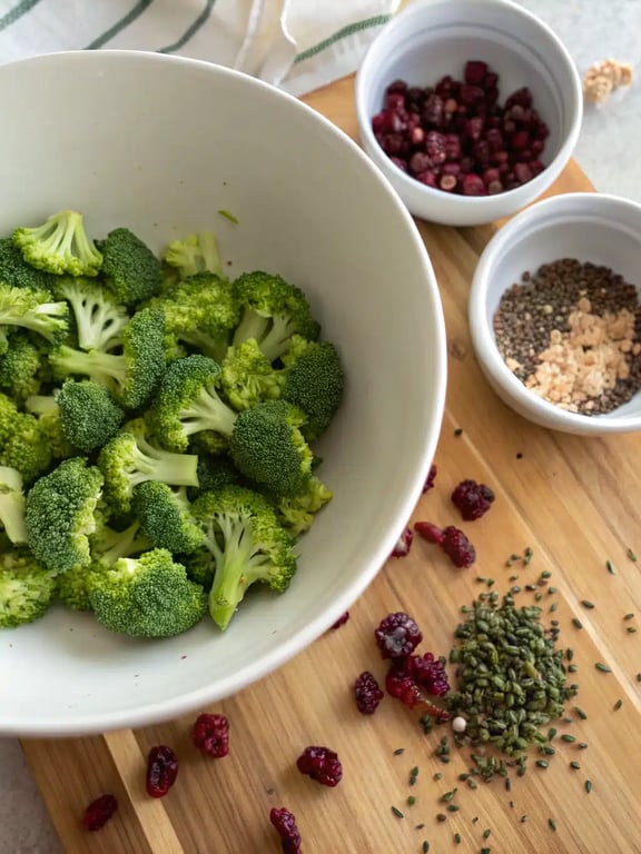 Step 2 for broccoli salad recipe — whisking the creamy dressing in a bowl