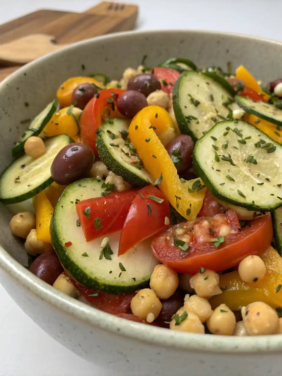 marinated vegetable salad recipe beautifully plated on a table with other dishes