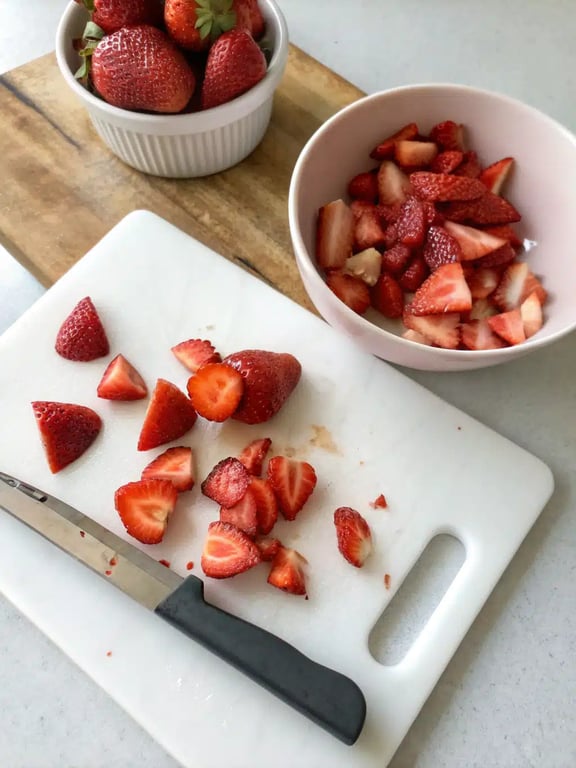 Whisking the strawberry salad dressing in a glass jar
