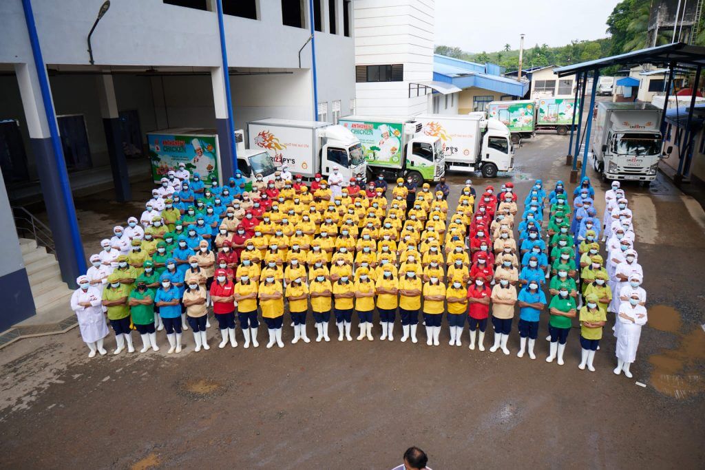 Anthony’s Farm Staff members standing in front of the factory