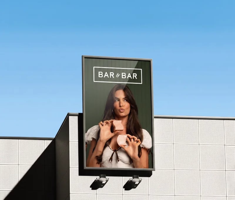 Bar & Bar billboard on a building against a blue sky