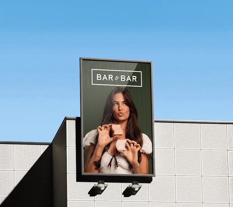 Bar & Bar billboard on a building against a blue sky