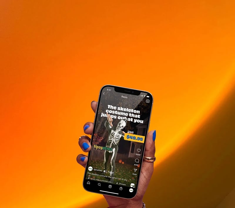 Tipsy Elves skeleton costume video ad on a phone against an orange background
