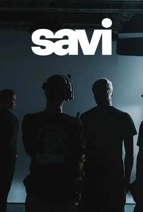 Savi audiovisual crew in silhouette backstage at a live event