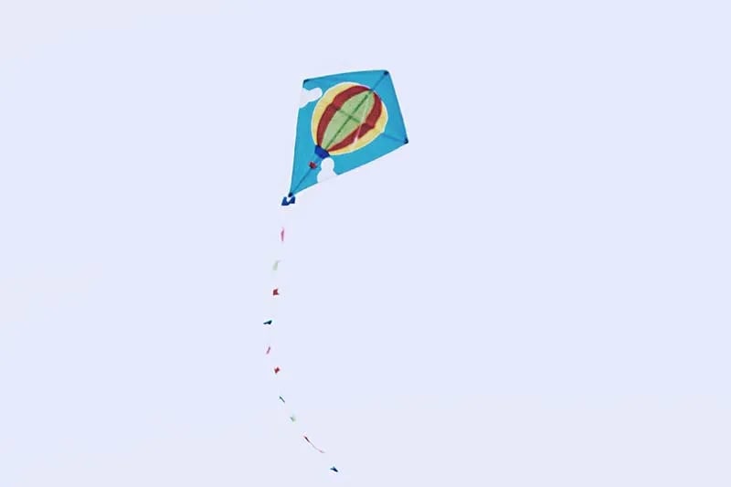 a blue kite in the sky