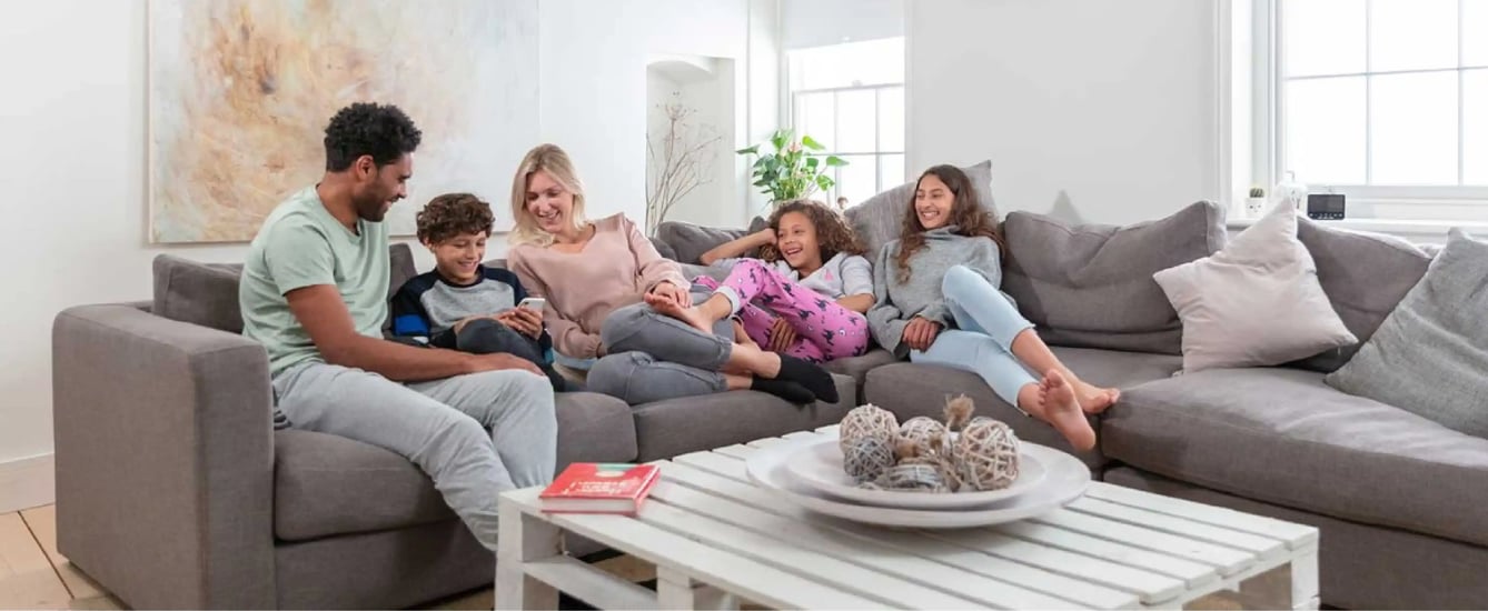 What is the ideal room temperature for comfortable living across different ages, including children and adults?