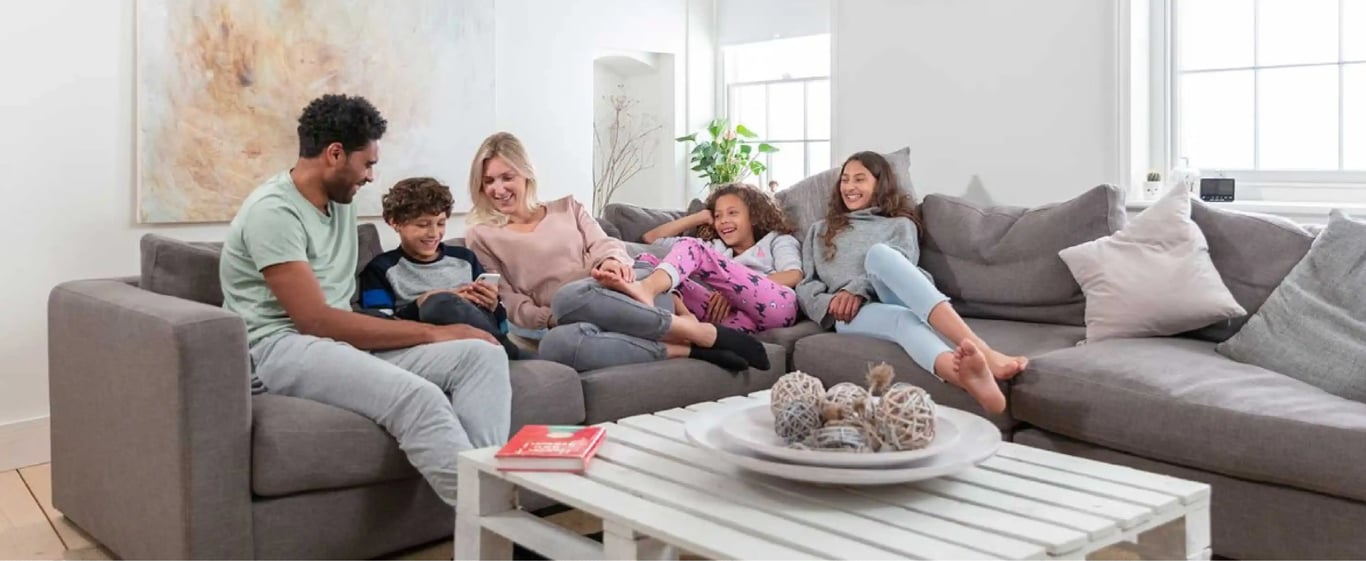 What is the ideal room temperature for comfortable living across different ages, including children and adults?