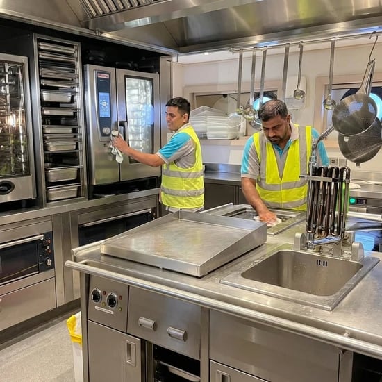 FAJ technicians maintaining commercial cooking appliances in a professional kitchen