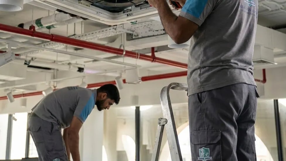 FAJ technician servicing an air-conditioning system in Dubai