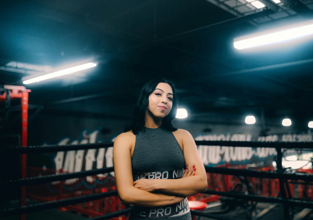 anime tattoo before photo - woman standing in a boxing field