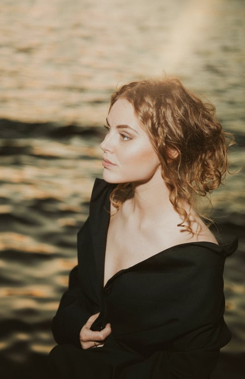 a portrait of a person edited with instant camera aesthetics, including muted saturation, lifted shadows, mild highlight bloom, and a calm nostalgic feel