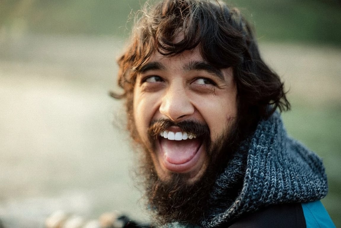 AI teeth whitening filter after photo - bearded man laughing with whitened teeth