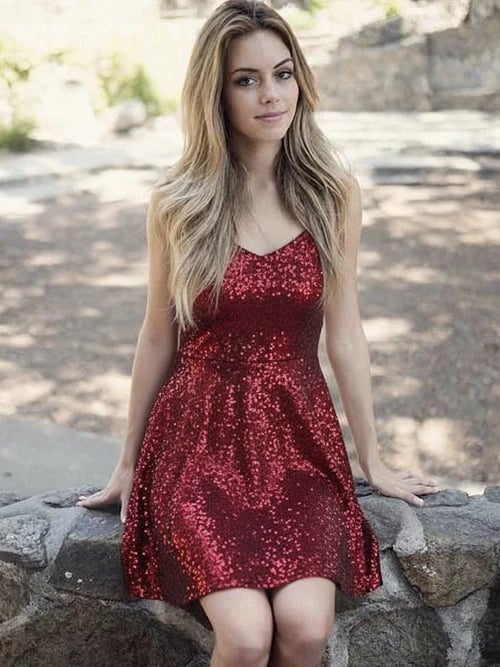 Holiday party outfit after image - person in a red sparkling holiday dress with festive mood