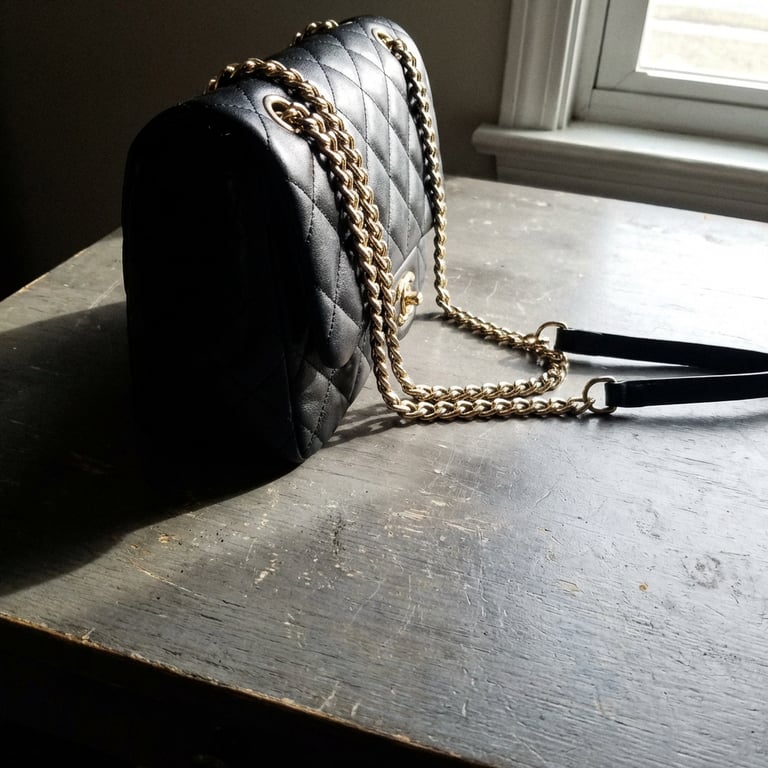 Enhance the handbag so it look...