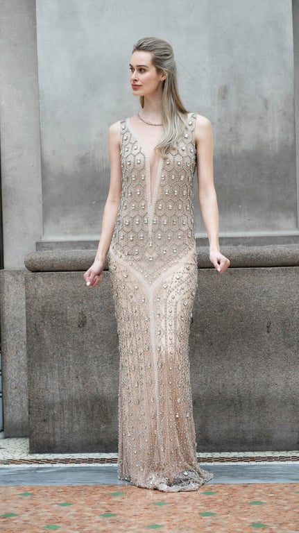 a portrait of a person edited to dramatically reduce waist width by aggressively pulling the waist inward on both sides, while keeping hip width unchanged or visually wider, creating a very high waist-to-hip ratio and an unmistakable hourglass silhouette with an obvious before-and-after difference