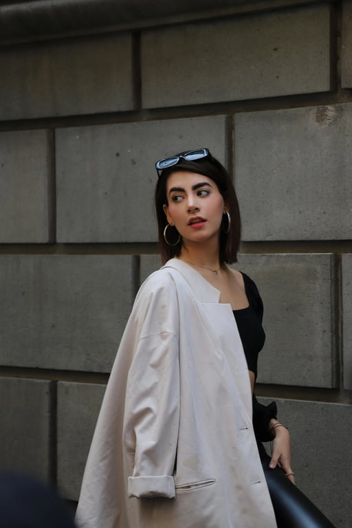 a portrait of a person rendered in an anime-inspired Japanese art style featuring stylized eyes, simplified nose and mouth, clean outlines, soft cel shading, balanced proportions, and a polished modern anime illustration appearance