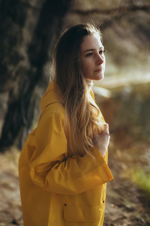 a portrait of a person processed to remove only non-natural light artifacts such as lens flare spots, streaks, and chaotic shadows, while keeping intentional facial lighting, realistic depth, and natural skin texture