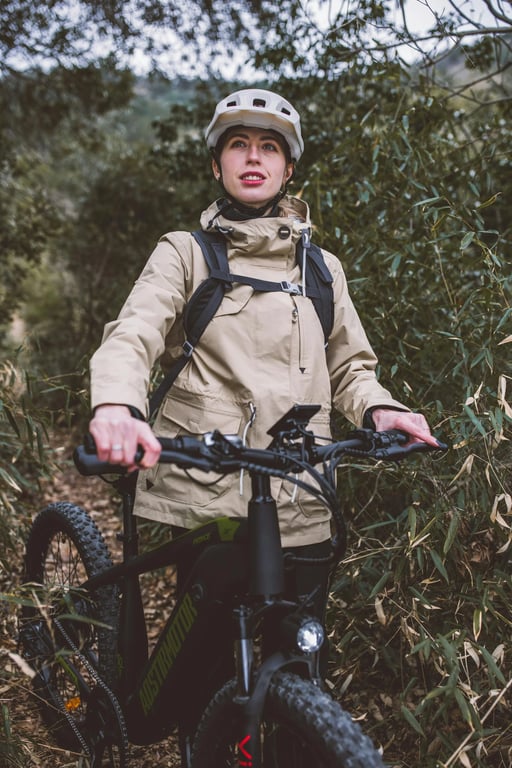 a portrait of a person engaged in an active hobby like hiking or cycling, captured candidly with natural sunlight and a genuine expression