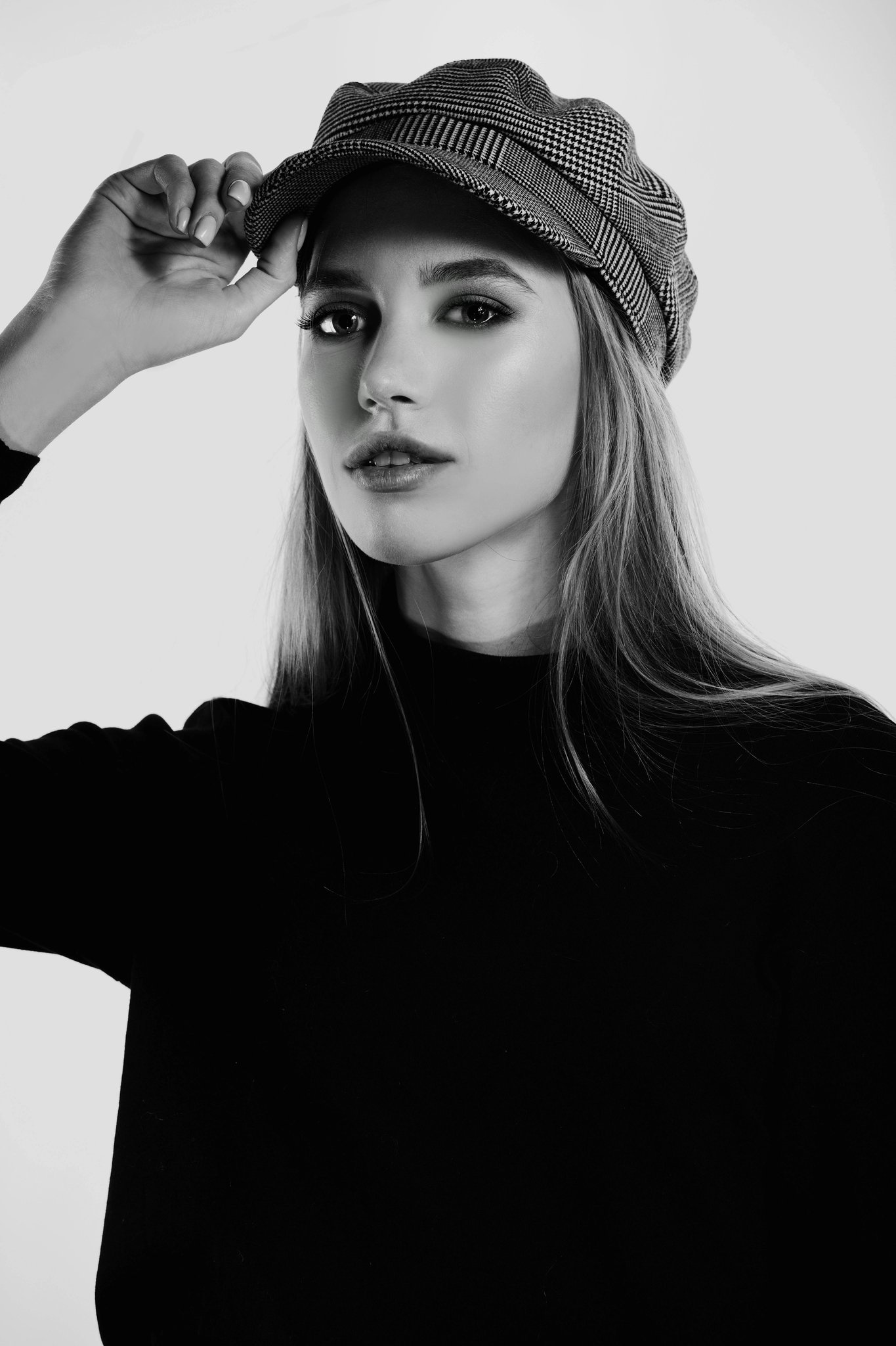 Chic Style filter before photo - neutral portrait in basic top against plain wall