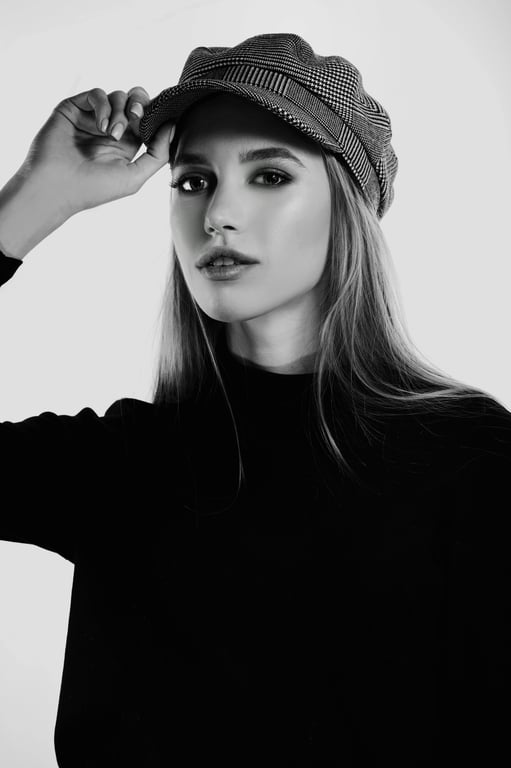 Chic Style filter before photo - neutral portrait in basic top against plain wall