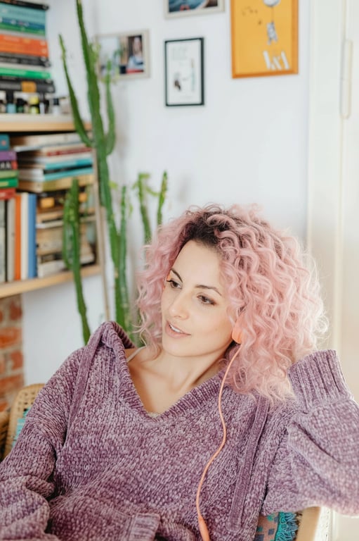 a portrait of a person edited to display soft pink hair tones with realistic root fade and even color distribution