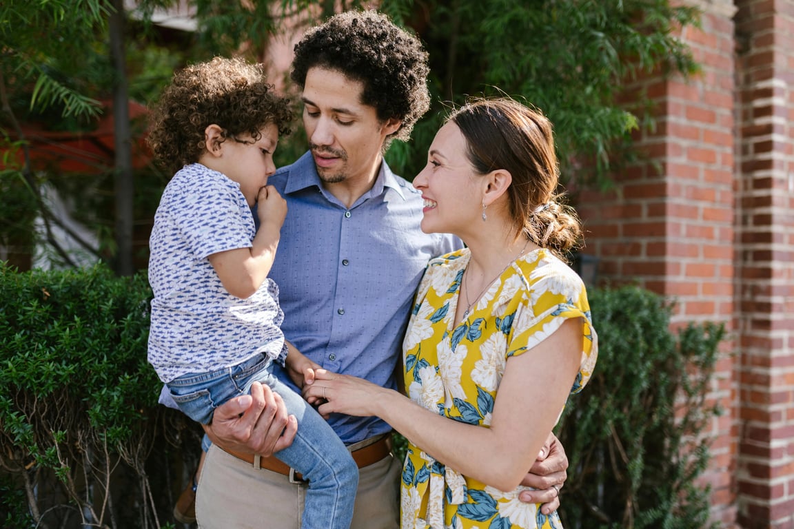 a portrait of a family transformed into a cinematic storytelling family portrait, all members styled in coordinated outfits with a unified color palette, placed in a dramatic but soft-lit environment, using intentional poses and expressions to create a movie-like family scene with strong narrative feeling