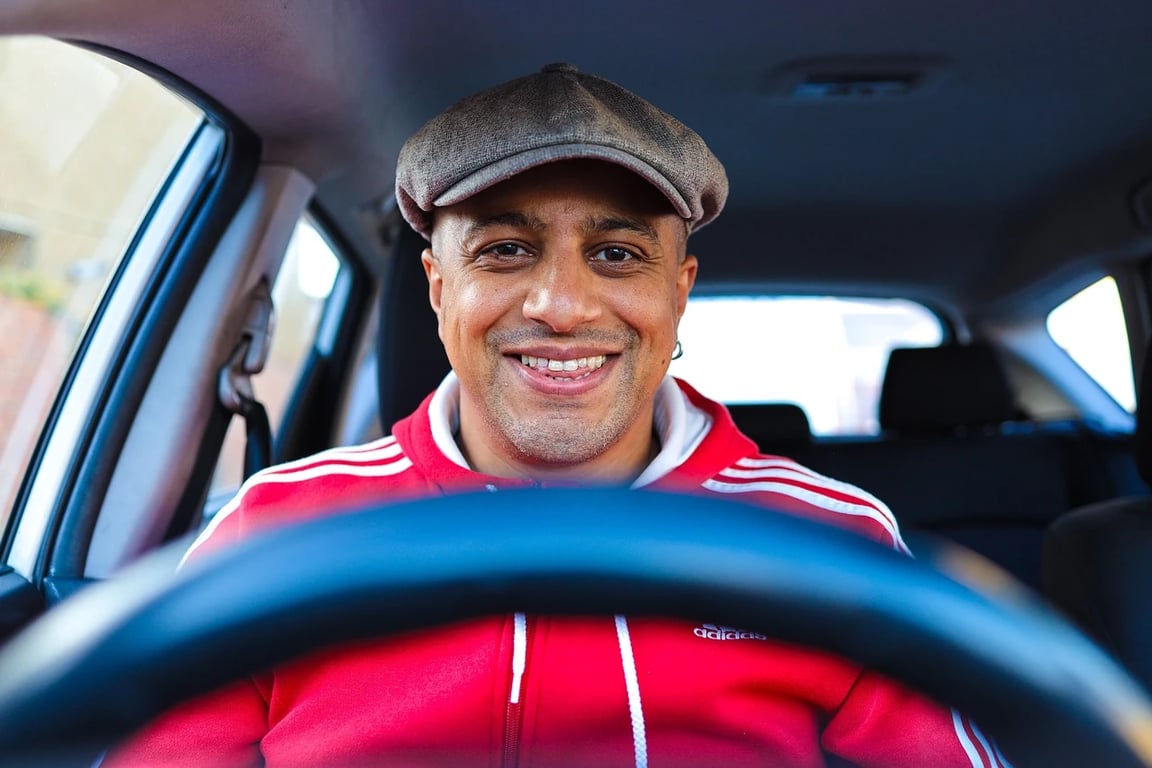 AI teeth whitening filter before photo - young man driving car smiling