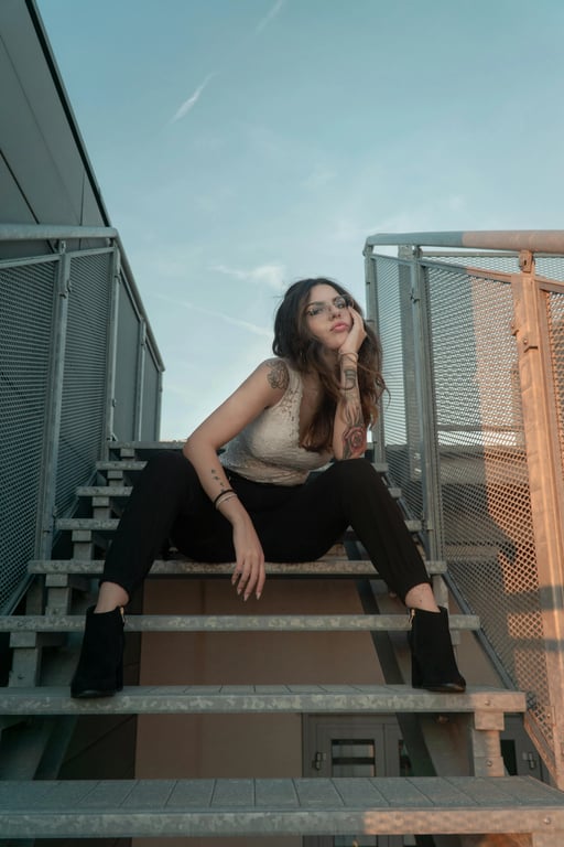 a GTA-style character illustration that keeps the original subject’s identity and posture, simplifies textures into painted surfaces, enhances facial angles and shadows, uses bold outlines and cinematic lighting, and places the character against a minimal GTA poster-style background