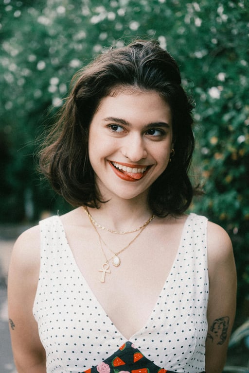 a portrait of a person styled with pink hair that reflects light naturally and avoids flat or painted appearance