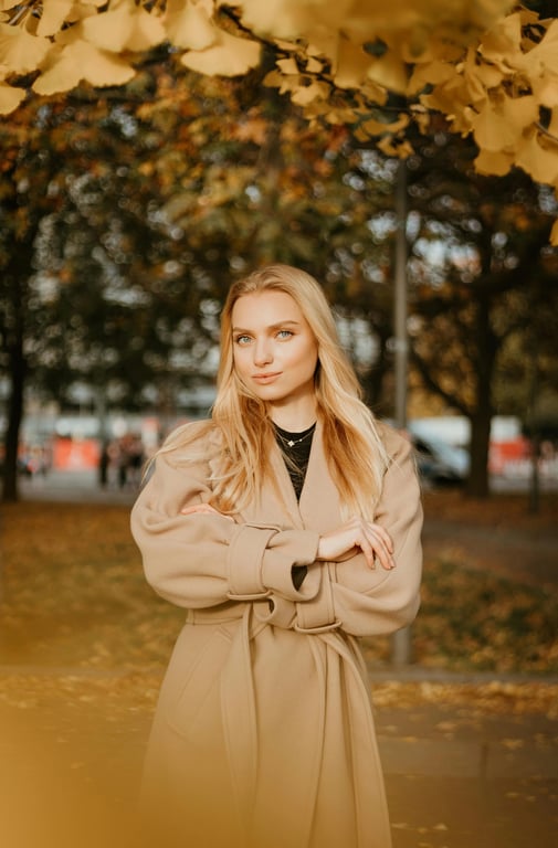 AI big eyes filter before photo - woman wearing a coat standing portrait