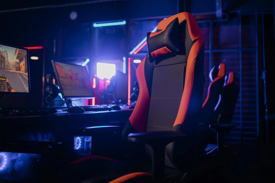 a hyper-realistic chicken nugget sitting in a gamer chair, staring at a computer screen, neon lighting, detailed but absurd scene.