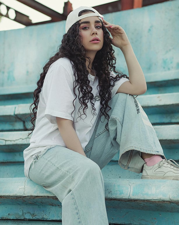 a portrait of a person transformed into a Polaroid-style instant photo with smooth tones, gentle haze, soft contrast, and subtle vignette