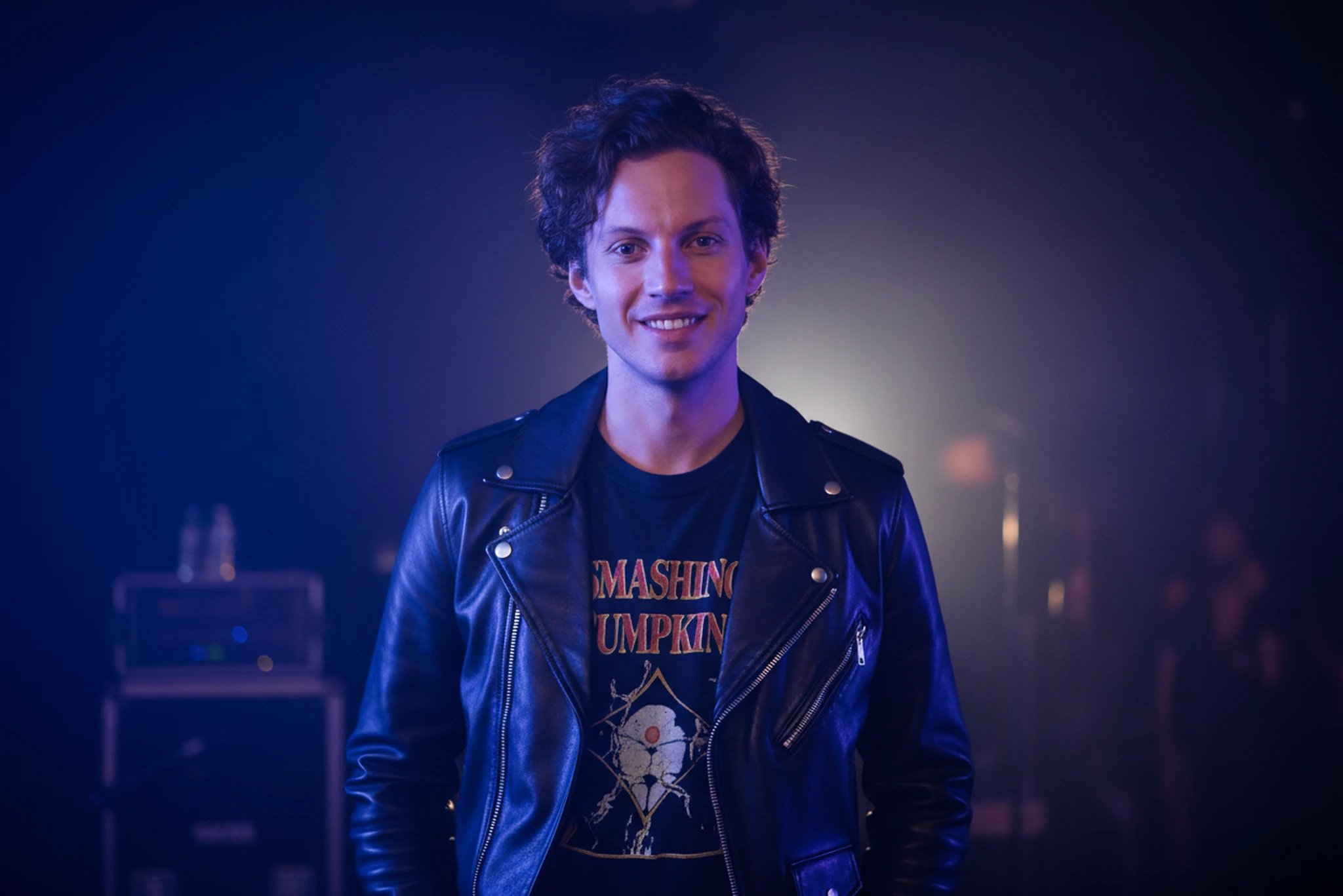 90s theme party clothes filter after transformation - portrait wearing 90s rock party clothes with moody concert vibe