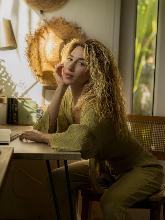 AI ugly filter before photo- woman with golden hair sitting and looking sideways