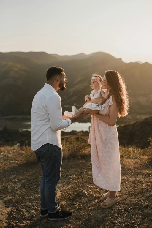 Generate a crest symbolizing adventure and shared stories, inspired by the adventurous spirit and natural, rugged colors (khaki, stone grey) of the family hiking photo. Incorporate mountain peaks and a winding path motif.