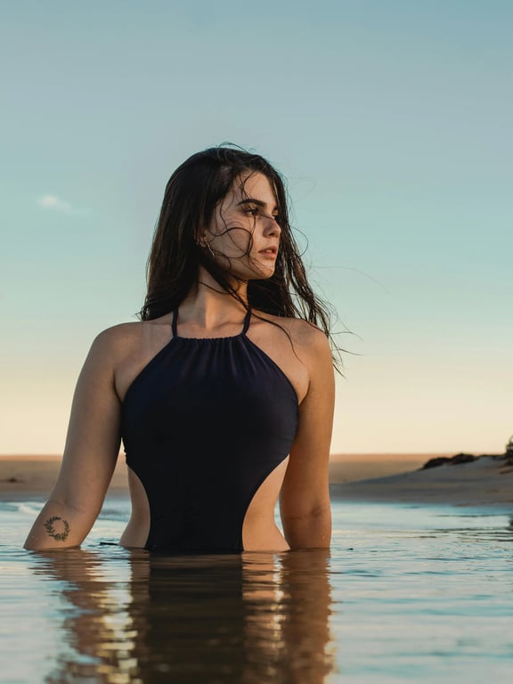 a portrait of people wearing swimwear, edited to change the bathing suit into a new style with clearly defined swimsuit cut, adjusted neckline and leg opening, realistic fabric stretch, natural body proportions, smooth edge transitions around skin, balanced lighting, and a clean beach or poolside background