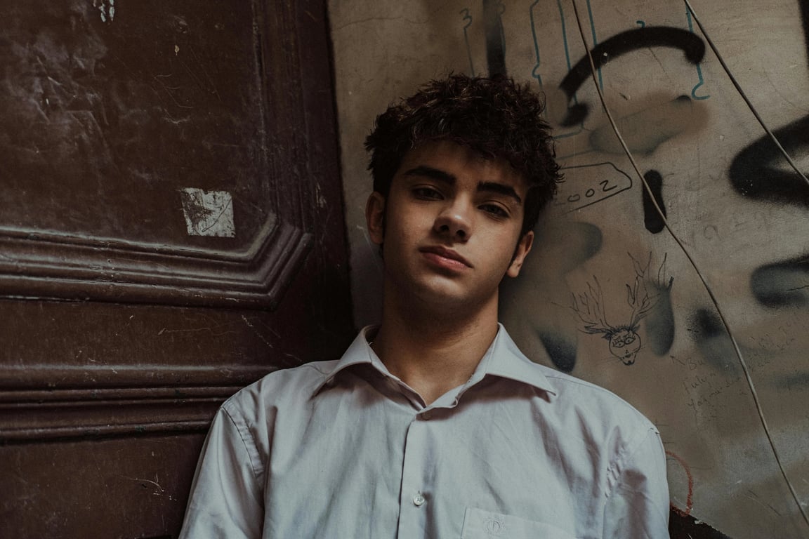 A scene of Jerry Smith comically falling through a multi-colored interdimensional portal, surrounded by floating plumbuses and screaming suns, his body and face stretched in panic.