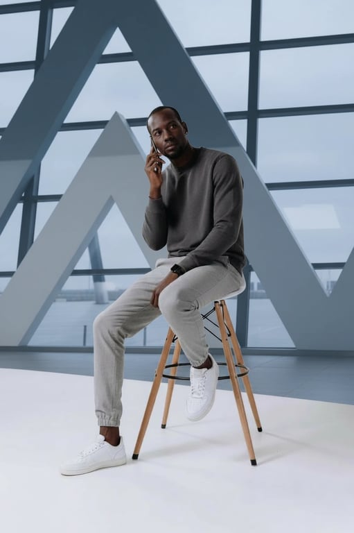 airport outfits filter after transformation - portrait wearing relaxed airport travel outfit with soft layers and sneakers