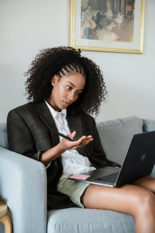 An AI-generated image showcasing a protective braided style with curly hair left out at the top, realistic blending, golden hour lighting, casual outfit.