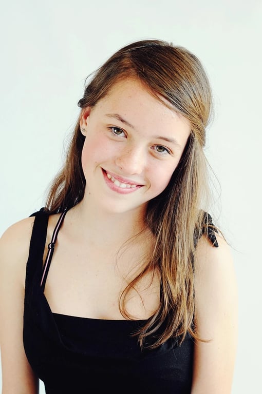 a portrait transformed with a pushed film grain style, featuring high contrast, heavy grain, and dramatic shadow details