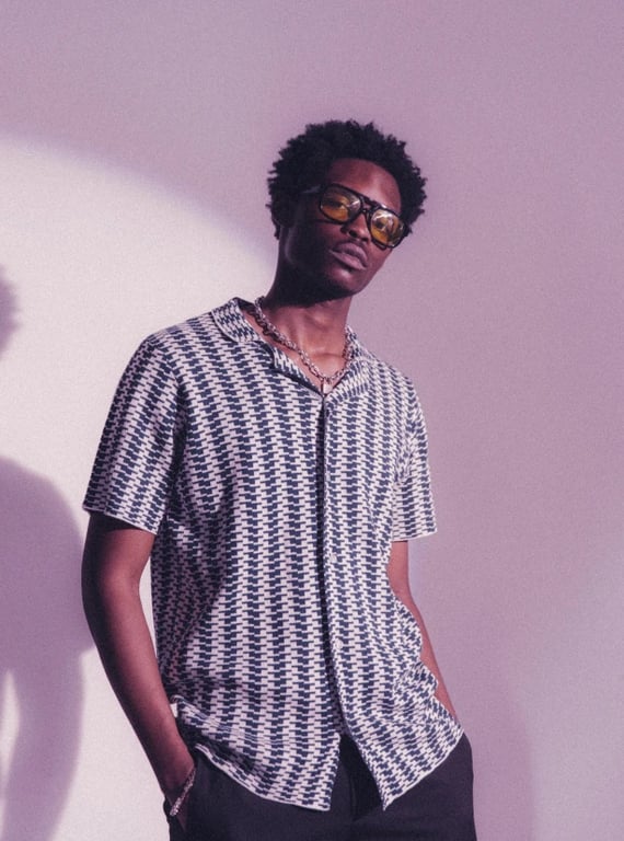 a portrait of a person enhanced with aesthetic outfit styling, smooth color transitions, fashionable simplicity, calm pose, and minimal backdrop