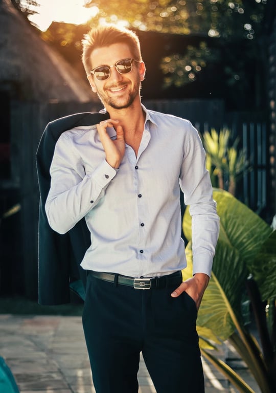 A warmly filtered environmental portrait of a man, harmony between warm subject lighting and cool background tones, balanced contrast, natural golden hour ambiance.