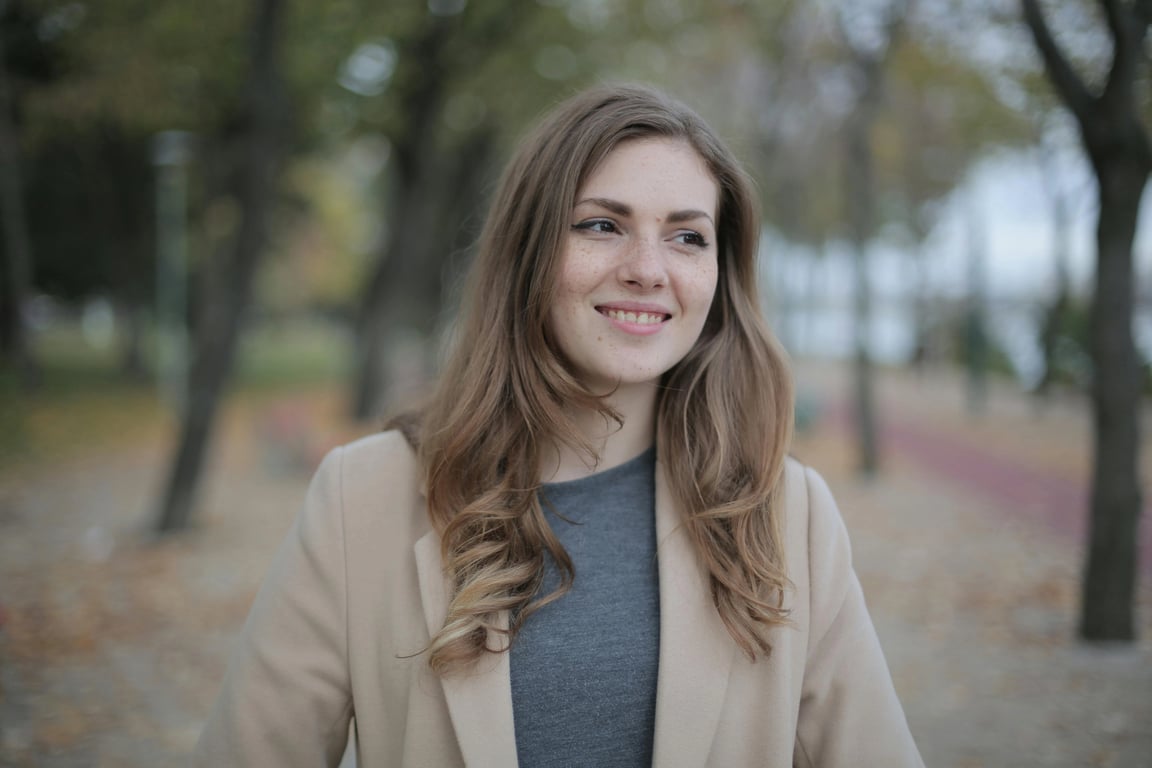 a portrait of a person edited to simulate golden hour sunlight with realistic light direction, warm color temperature, and natural contrast balance