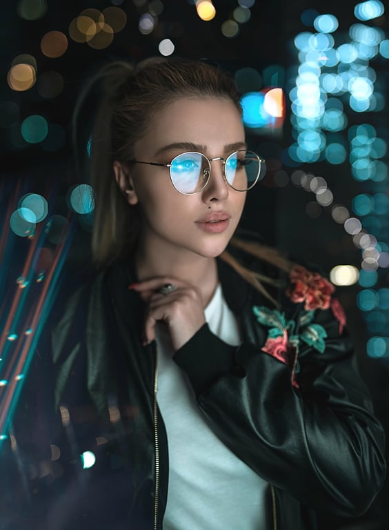 a portrait of a person where neon circuit board patterns glow beneath their skin, creating a high-tech biomechanical aesthetic