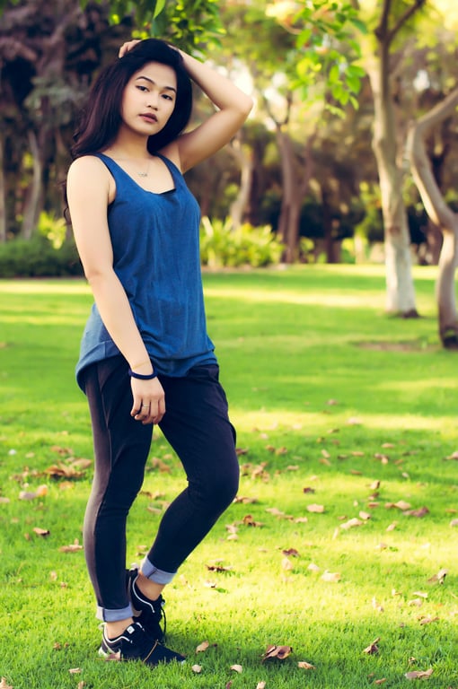 outfit generator ai before photo - woman standing on the grass