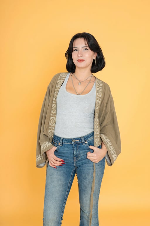 a portrait of a person transformed into a One Piece style character, wearing Luffy's straw hat with a wide, cheerful grin