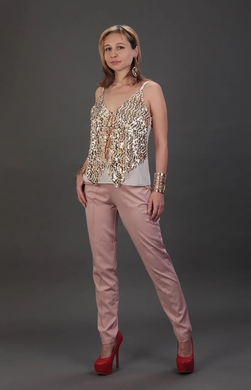 A photo of a woman wearing a fitted business dress or casual wear.