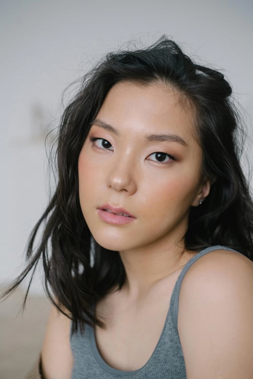 a portrait of a person styled with 70s bohemian outfit elements, flowing maxi skirts or wide-leg pants, lightweight blouses with subtle patterns, layered proportions, earthy muted tones, relaxed posture, and soft ambient lighting