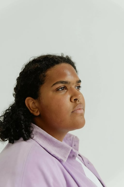 a portrait of a person edited to reshape the lower face by narrowing the jaw and reshaping the chin into a sharper and more pointed form, reducing jaw width substantially, creating a clear V-line face shape without changing eyes nose or mouth